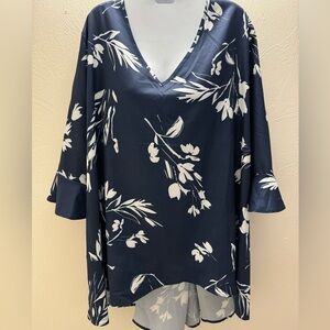 BloomChic NWOT navy floral top with 3/4 length sleeves with a ruffled cuff. 26
